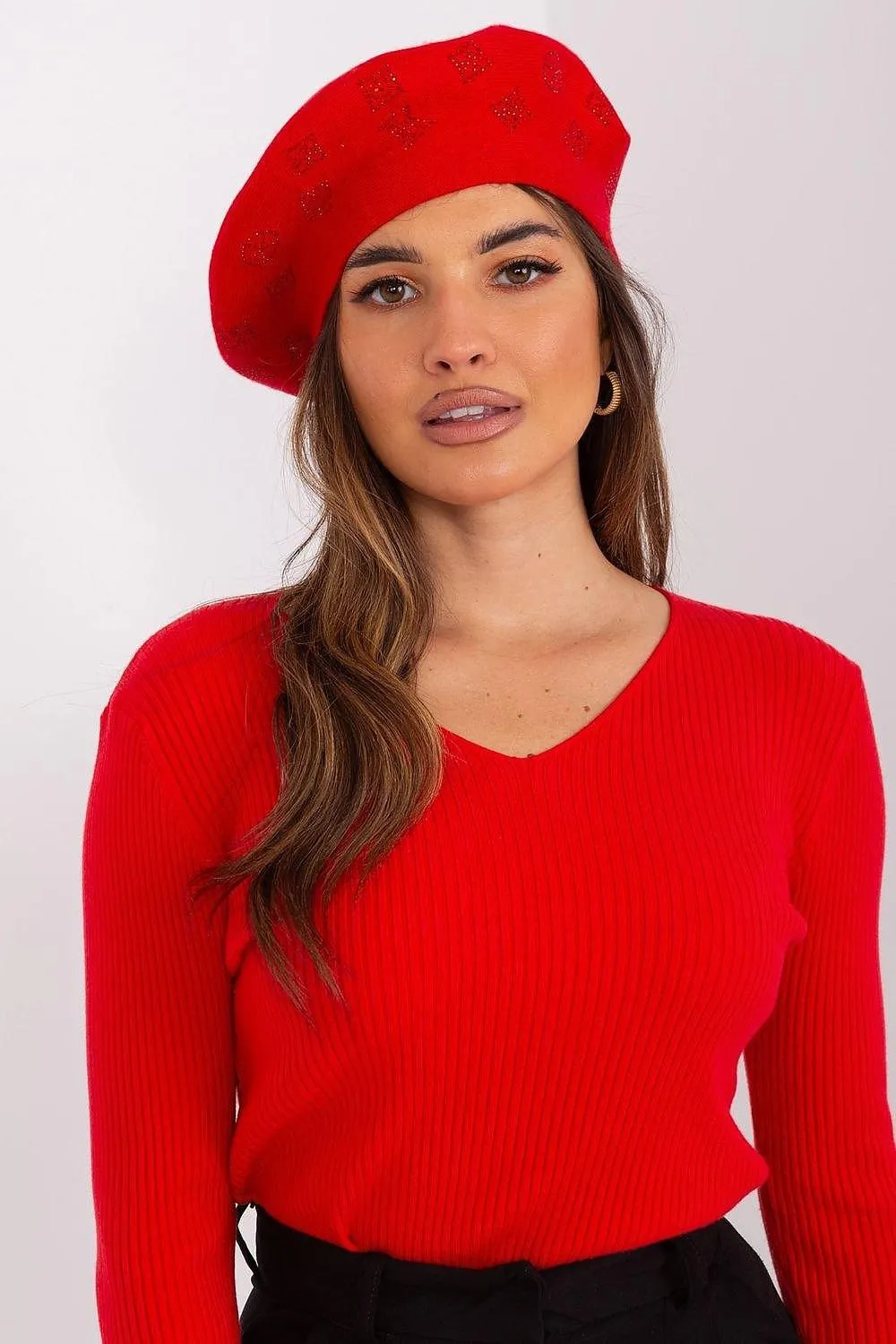 AT Knitted beret with interesting rhinestone application.